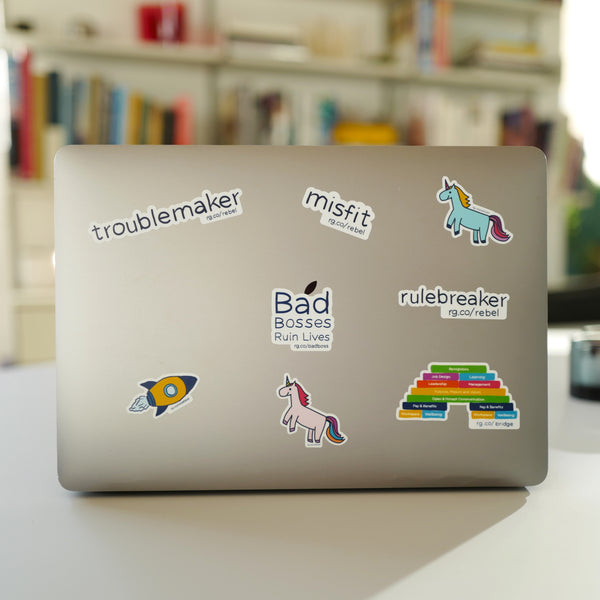 Rebel Playbook for Employee Engagement stickers on MacBook 